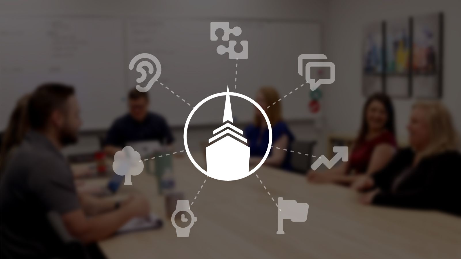 Spire's core values icons overlapping a blurred image of the Spire team having a meeting.